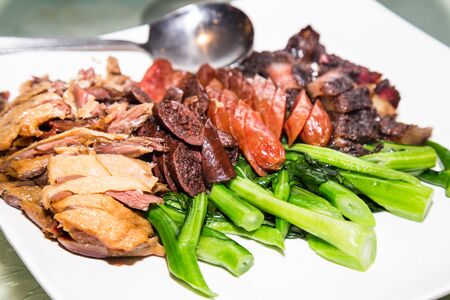 Waxed duck, sausage and preserved meat platter is a traditional delicacy taken by the Chinese during Chinese New Year celebration dinners.の写真素材