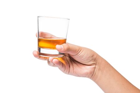Hand holding a glass of whiskeyの写真素材