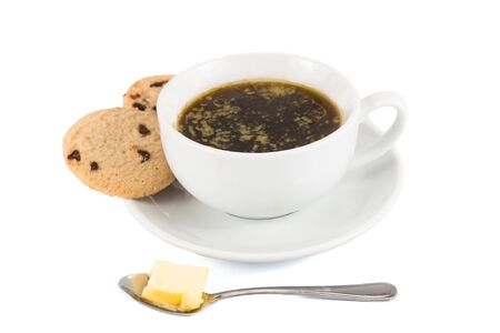 Black coffee with added butter, accompanied with butter cookieの写真素材