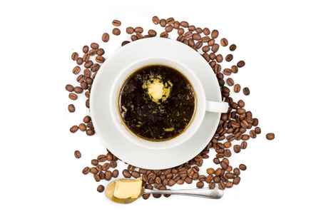 Black coffee with added butterの写真素材