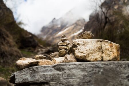 Zen rock arrangement along hiking trail to the mountains of Annapurna, Nepalの写真素材