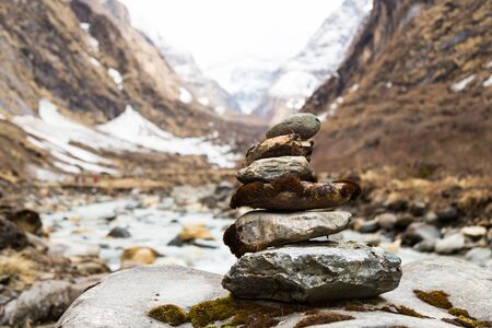 Zen rock arrangement along hiking trail to the mountains of Annapurna, Nepalの写真素材