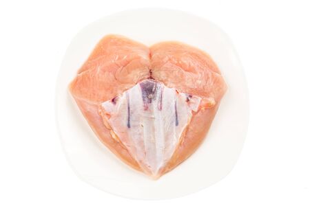 Fresh heart shaped skinless chicken breast meat with keel boneの写真素材