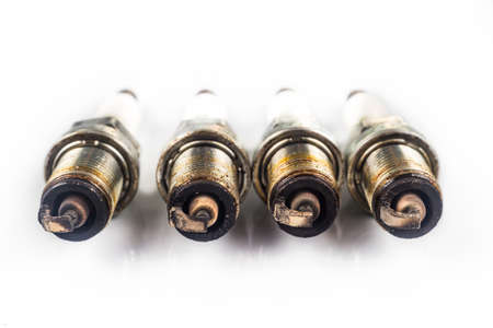 Close up of used spark plugs with focus on the electrode with depositsの写真素材