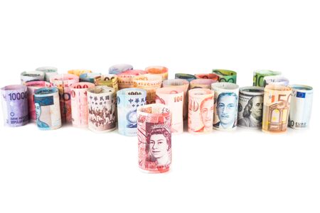 Pile of rolled-up currency notes with Sterling Pound in font.の写真素材
