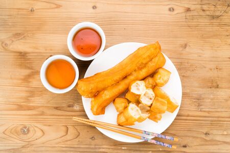 Fried bread stick or You Tiao served with Chinese tea