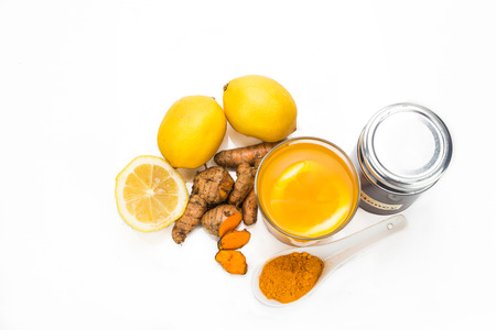 Turmeric roots with lemon and honey drinks, powerful healing beverage