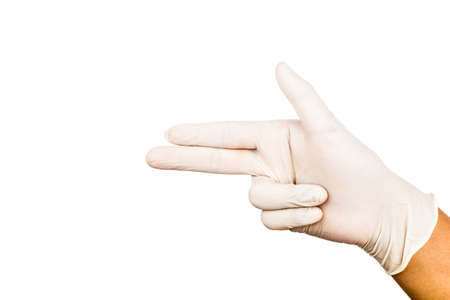 Hand in surgical latex glove gesture pointing and shooting .の写真素材