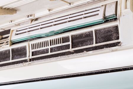 Dirty air conditioning unit full of dust and dirt on coil of indoor unitの写真素材