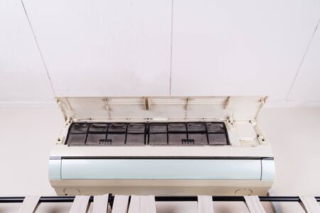 Dirty air conditioning unit full of dust and dirt on filters of indoor unitの写真素材