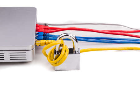 Concept of network security with padlock over router cable in white backgroundの写真素材