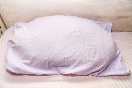 Fallen hair found on pillow upon waking up in the morningの写真素材