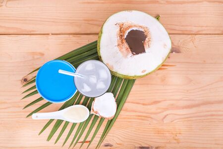 Overhead view of refreshing natural coconut juice with yogurt drinks helps food digestion