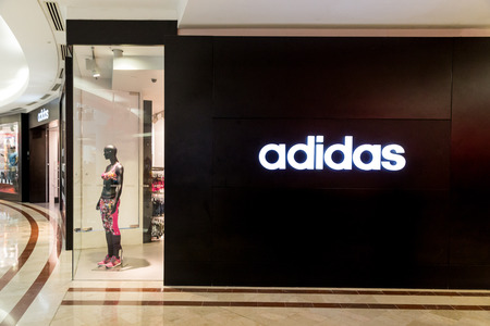 KUALA LUMPUR, MALAYSIA, May 20, 2016: Adidas signage on its outlet at KLCC, Kuala Lumpur.  Adidas was founded in 1948 in Germany, is one of the leading global sportswear manufacturer.のeditorial素材