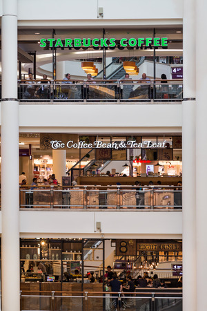 KUALA LUMPUR, MALAYSIA, May 20, 2016: Starbucks and The Coffee Bean & Tea Leafs outlets on different levels at KLCC Shopping Mall, Kuala Lumpur.  Both are international chain F&B outlets .のeditorial素材