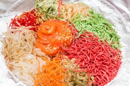 Yee Sang or Yusheng with raw salmon fillet, traditional Chinese New Year prosperity delicacies in Malaysia and Singaporeの写真素材