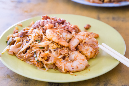 Close-up on popular Penang Char Kuey Teow or fried noodle with big prawns, popular cuisine in Malaysiaの写真素材