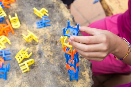 Kids playing the stacking chairs game during recreational partyの写真素材
