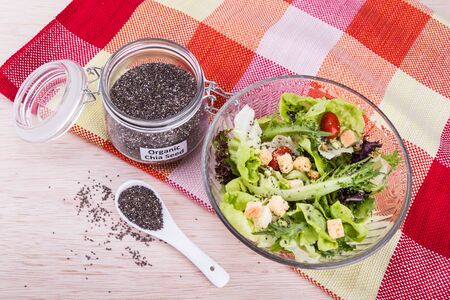Organic chia seeds with salad healthy meal loaded with fibre and antioxidantの写真素材