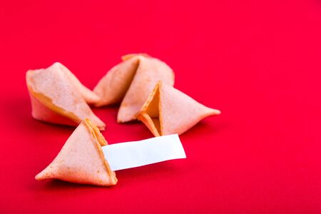 Chinese Fortune Cookies with blank predictive label on red backgroundの写真素材