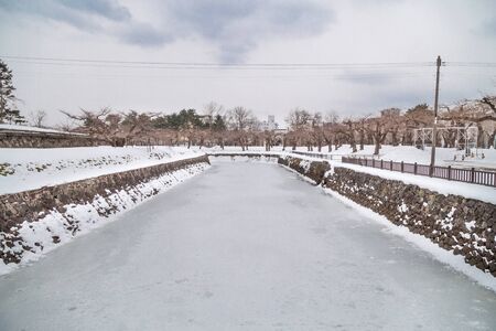Frozen moat of Hakodate Japan fort Goryokaku during winter, popular tourist destinationの写真素材