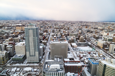 Sapporo, Japan, January 28, 2018:  Aerial sunset view of central Sapporo city during winter with snowのeditorial素材
