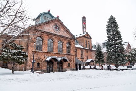 Sapporo, Japan, January 28, 2018:  Sapporo Beer Museum is popular tourist attraction.  Featured here is the main red brick building during winter with heavy snow.のeditorial素材
