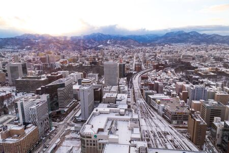 Sapporo, Japan, January 28, 2018:  Aerial sunset view of central Sapporo city during winter with snowのeditorial素材
