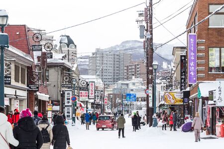 Otaru, Japan, January 28, 2018: Retail market is tourist attraction during winter in Hokkaido, Japan. Landcape of shops at the Sakaimachidori street.のeditorial素材