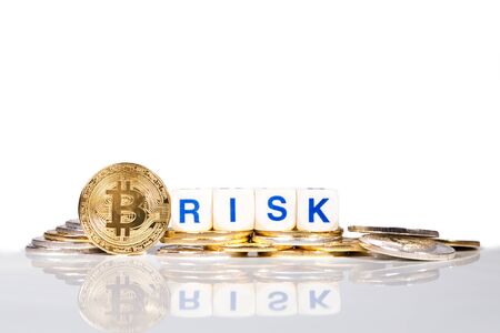 Conceptual cryptocurrency bitcoin with the word Risk on white backgroundの写真素材