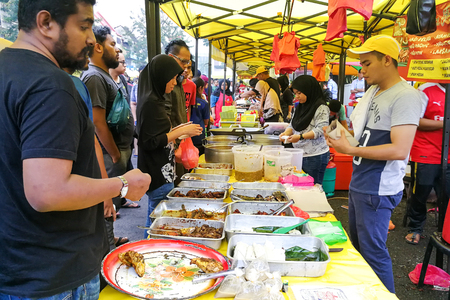 KUALA LUMPUR, MAY 23 2018: Vendors selling cuisine at street bazaar catered for iftar or breaking fast during the Muslim fasting month of Ramadanのeditorial素材