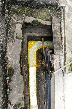 Aerial view of dirty smelly clogged polluted drain in urban city poses hygiene and health riskの写真素材