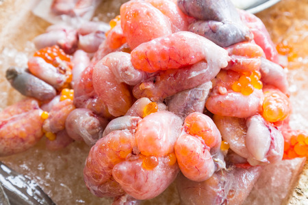 Fish roe or eggs, freshly dissected from fish in market.  High cholesterol.