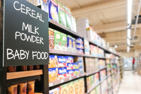 Cereal, milk powder, baby food signage grocery categoy aisle at supermarketの写真素材