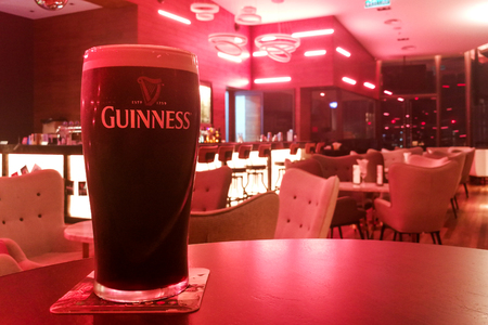 KUALA LUMPUR, MALAYSIA, APpril 18, 2019: Guinness is an Irish dry stout that originated in the brewery of Arthur Guinness at St. James's Gate brewery, Dublin, Ireland. Leading black stout in Malaysiaのeditorial素材