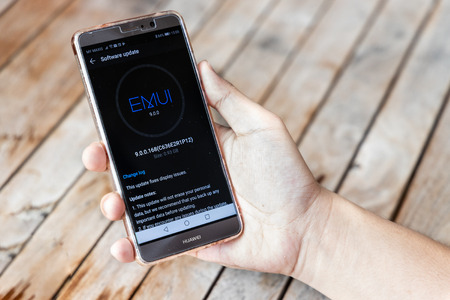 KUALA LUMPUR, MALAYSIA, MAY 21, 2019: Person holding Huawei Mate phone, ready to update the Operating System. U.S. companies began  to curb sales to Chinese telecom Huaweiのeditorial素材