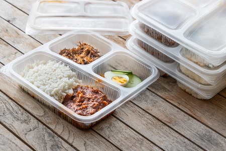 Conveniently packed delicious nasi lemak meal for take away delivery, in environmental friendly biodegradable containerの写真素材