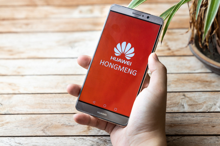 KUALA LUMPUR, MALAYSIA, MAY 25, 2019: Person holding Huawei Mate phone with Hongmeng OS symbol. U.S. companies began  to curb sales to Chinese telecom Huaweiのeditorial素材
