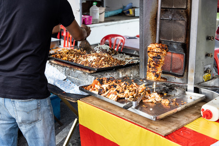 Vendor selling kebab in street market bazaar for iftar during muslim ramadan fasting month in Malaysiaの写真素材