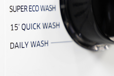 Closeup on Quick or Speed Wash  function on washing machine to save time