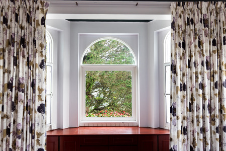 Refreshing greenaries, nature view from home interior through glass window in  tropical highlands