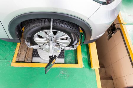 Car wheel clamp with wheel align device for wheel alignment in workshopの写真素材