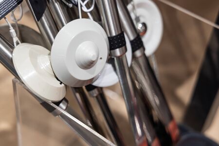 Closeup of retail theft prevention security tag on merchandise to deter theftの写真素材