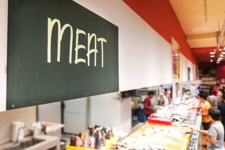 Meat signage at the meat perishable produce section of supermarket with defocused backgroundの写真素材