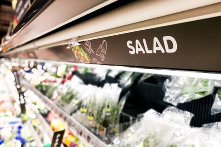 Salad signage at supermarket produced food section with defocused backgroundの写真素材