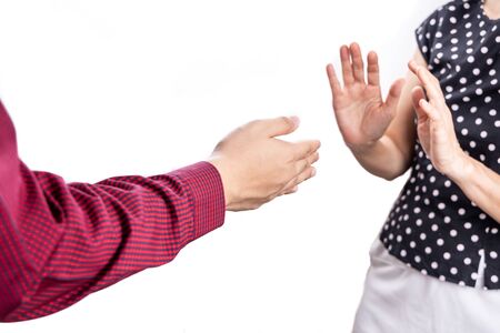 Person refused handshake to prevent coronovrus covid-19 transmission. Social distancing in practice.
