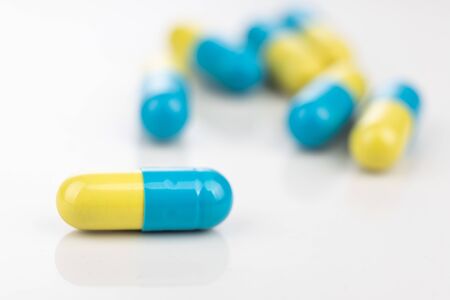 Close-up of group medicine drug in capsule format on white backgroundの写真素材