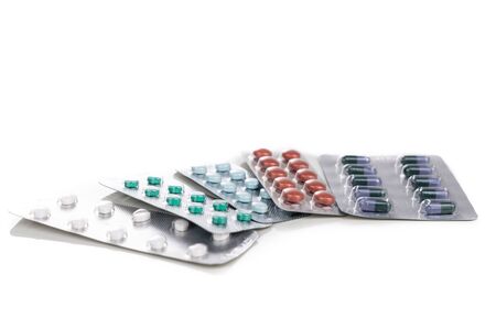 Multiple strips of pills tablet, caplet, capsule. Medication for various disease on white background