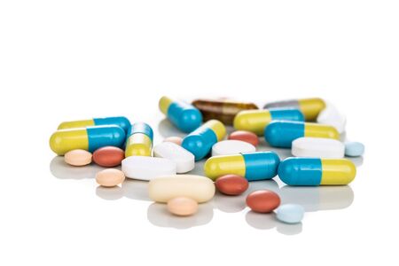 Multiple pills, tablet, caplet, capsule. Medication for various disease on white background