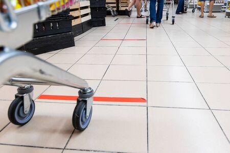 People embracing the new normal with social distancing in checking out at supermarket in Malaysiaの写真素材